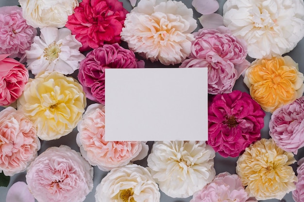 floral pattern with paper blank in the centre branding mock up holiday marketing concept