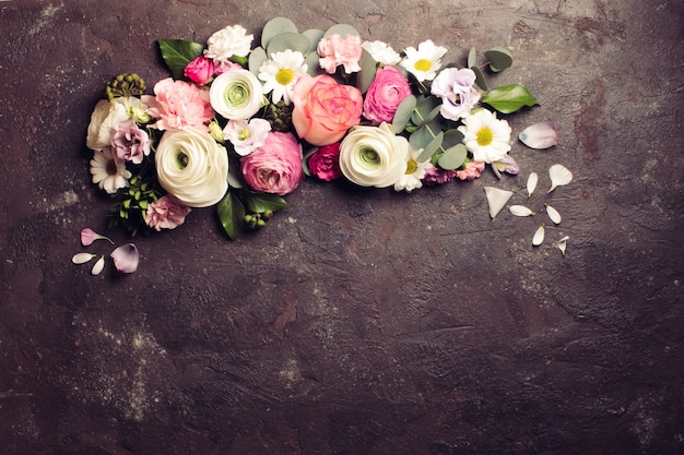 Floral round frame with eucalyptus branches and leaves, flat lay flowers, top view with copy space