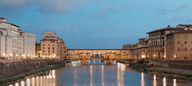 Florence Italy circa July 2021 Sunset light on Ponte Vecchio Old Bridge