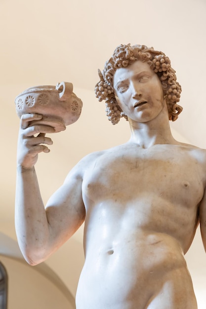 Florence, Italy - Circa June 2021: Bacchus by Michelangelo Buonarroti, 1501. Ancient sculpture made of white marble