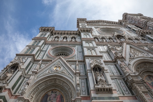 Florence, Italy - June 24, 2018: Closeup view of facade of Cattedrale di Santa Maria del Fiore (Cathedral of Saint Mary of the Flower) is the cathedral of Florence