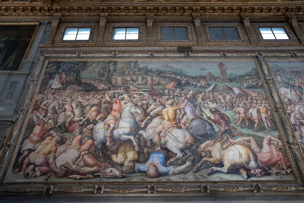 Florence, Italy - June 24, 2018: Closeup view of pictures by Italian artists in Palazzo Vecchio (Old Palace) is the town hall of Florence