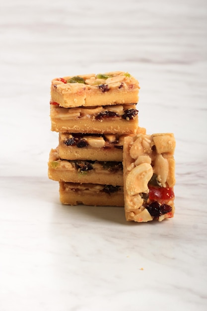 Florentine Cookies for Ied Fitr. Isolated on White Table Background. Florentine Kue Kering  Popular in Indonesia Made from Flour and Dried Fruit and Raisin. Served during Lebaran. Copy Space for Text