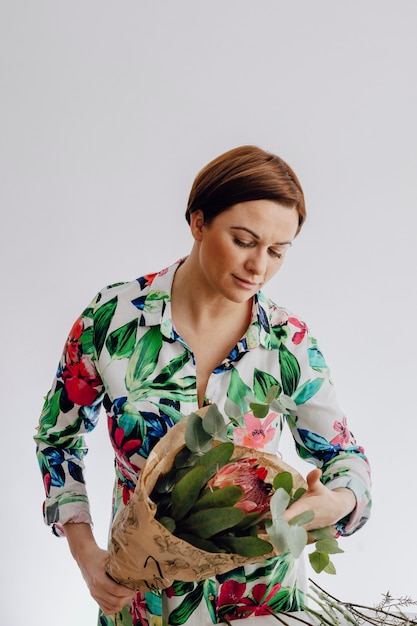 Florist arranging a bouquet of flower