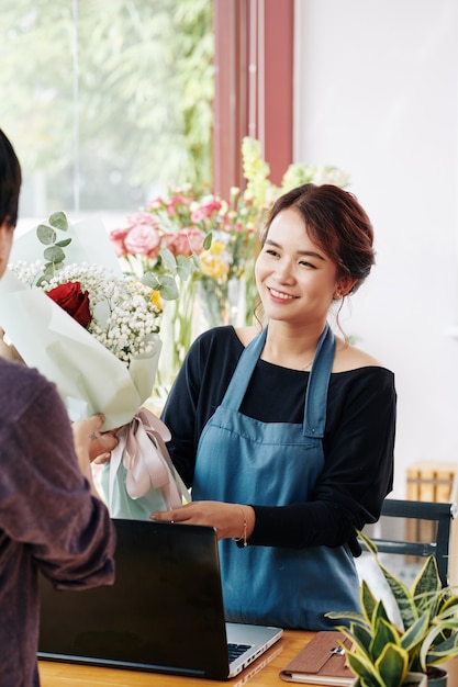 Florist selling bouquet