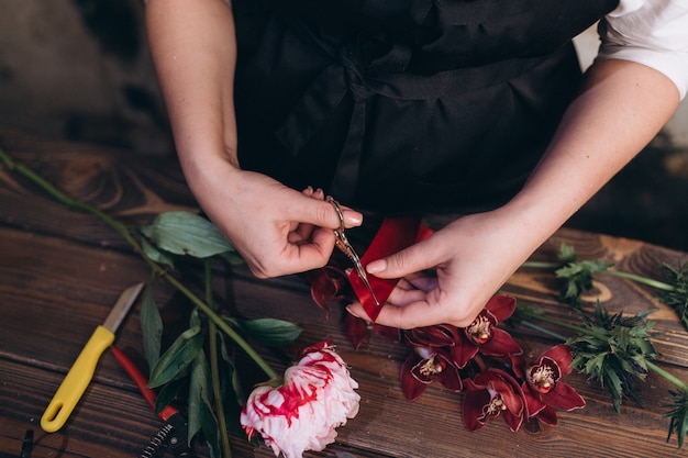 Florist work with flowers