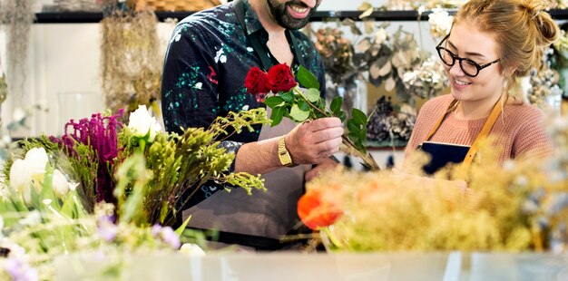 Florists making flower bouquet together