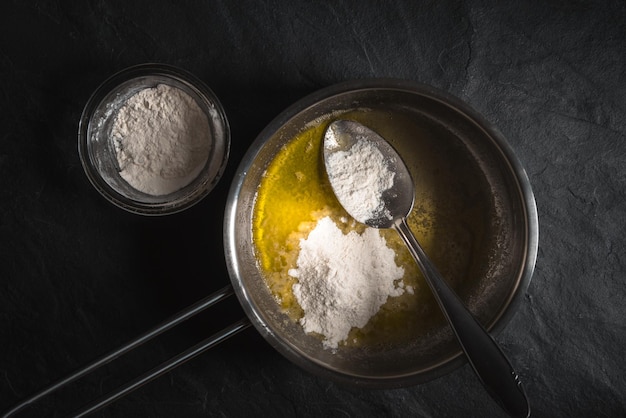 Flour in melted butter for roux cooking