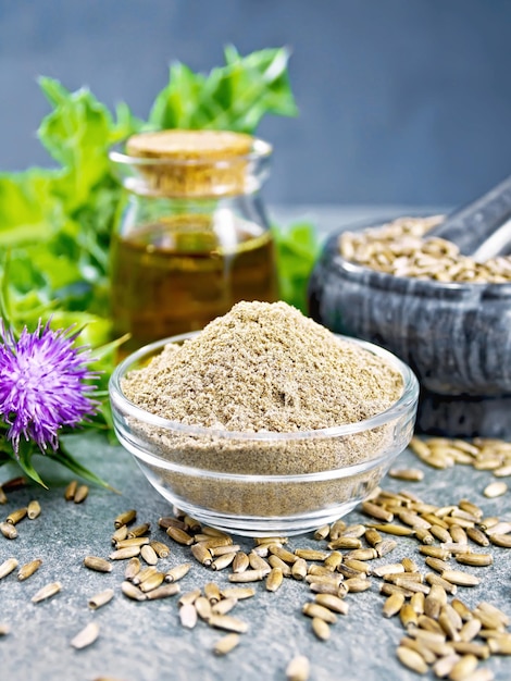 Flour milk thistle in bowl on granite