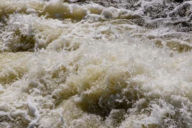 Flow of water and spray from a stone