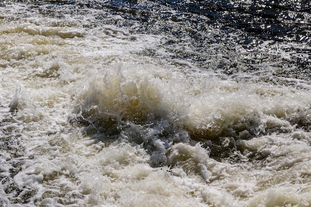 Flow of water and spray from a stone