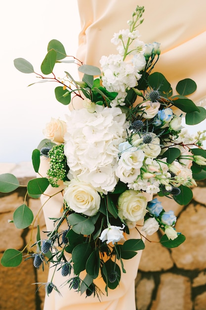 Flower arrangement decorating the wedding arch