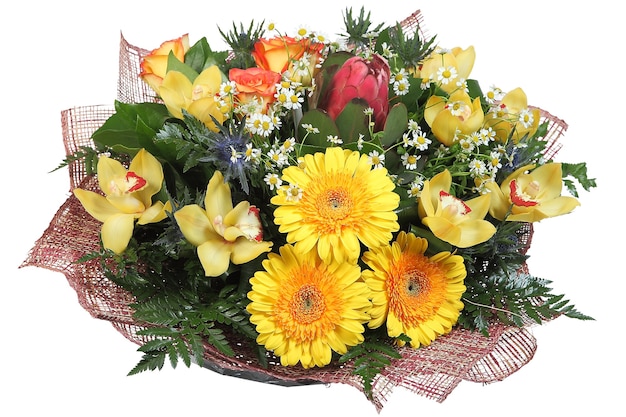 Photo flower arrangement large mixed floral bouquet of yellow gerberas, pale yellow orchids, artichokes, orange roses, feverweed, daisies and ferns, isolated on white background.