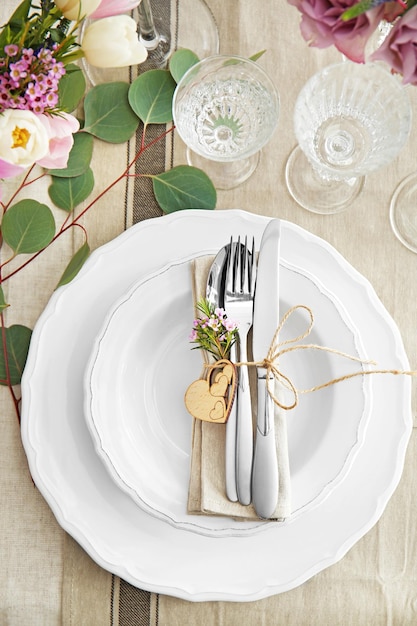 Flower arrangement on table served for wedding dinner
