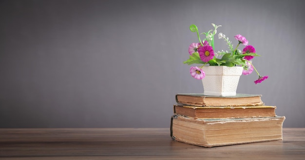 Flower and book on the wooden table