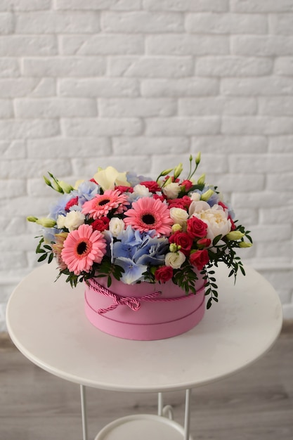 Flower bouquet in a box inside a store. Women's Day