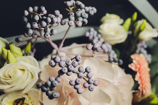 A flower bouquet with a lot of a different flowers