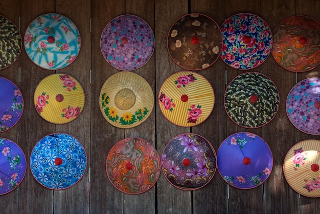 Flower painted hat on a wooden door