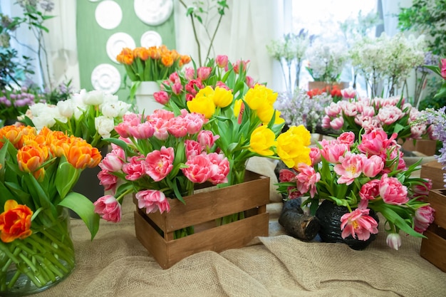 Flower shop sale of flowers Beautiful blooming composition of colorful tulips Bright colorful tulip photo background