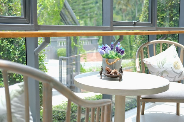 flower in tin bucket on table in living room