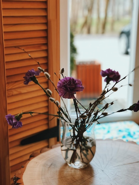 Photo flower vase on table at home