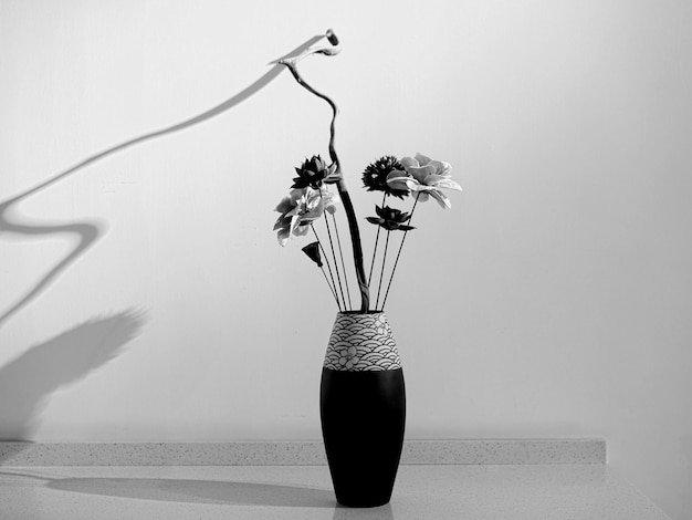 Photo flower vase on table at home