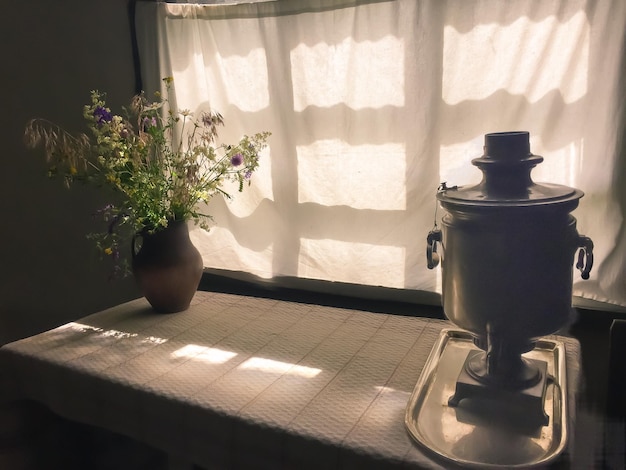 Flower vase on table at home