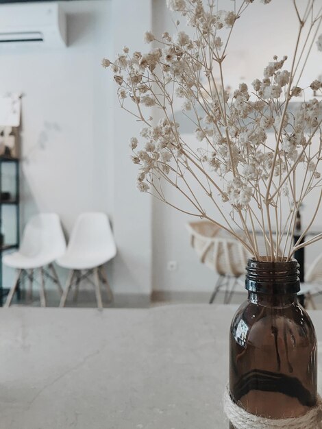 Photo flower vase on table at home