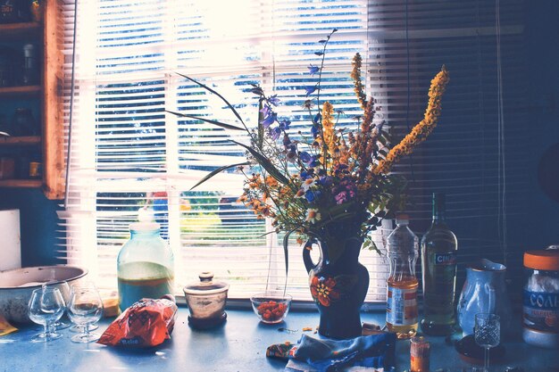 Photo flower vase on table at home