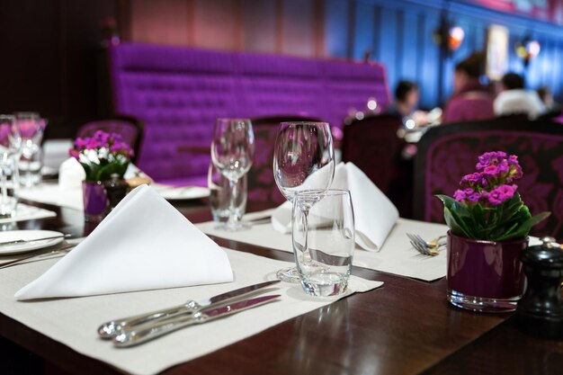 Flower vase on table in restaurant