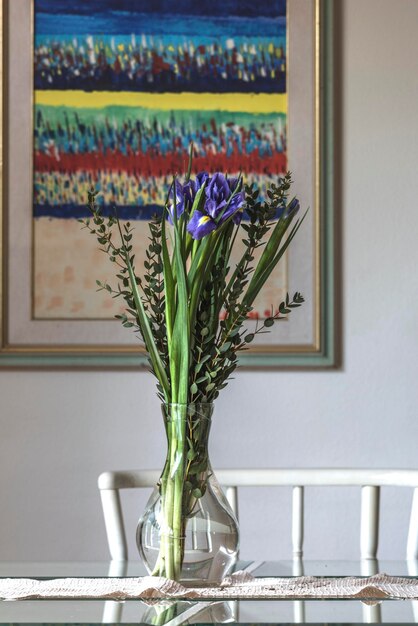 Photo flower vase on window sill at home