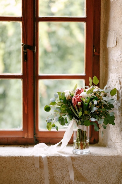 Photo flower vase on window sill