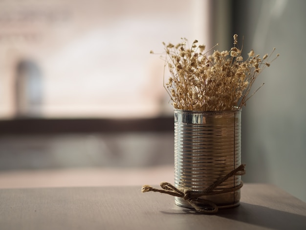 Flowering dried grass in aluminium pot for room decoration.