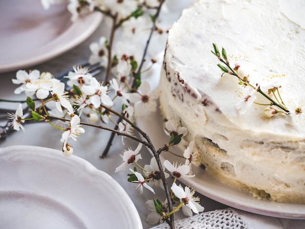 Flowering tree and fresh, homemade cake. Close-up