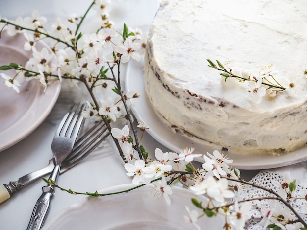 Flowering tree and fresh, homemade cake. Close-up