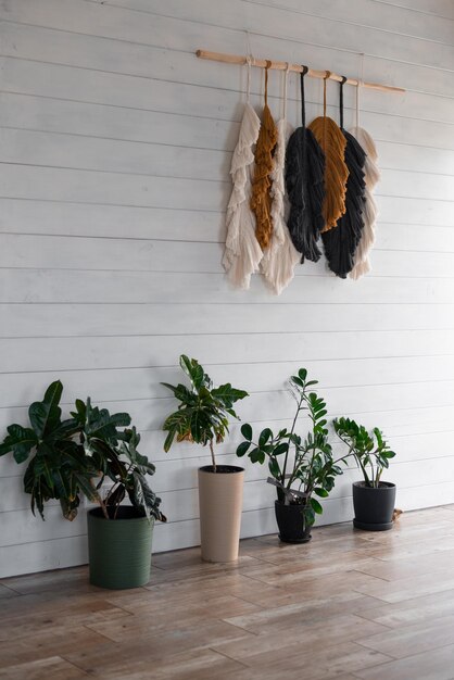 Photo flowerpots and macrame panels in the design of a local cafe