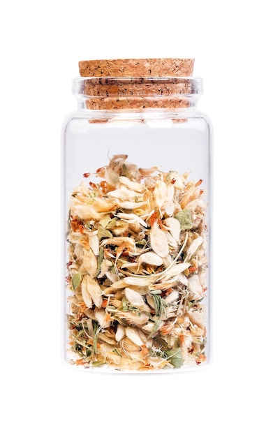 Flowers of Astragalus root in a bottle with cork stopper for med