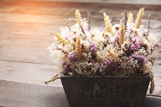 Flowers bouquet on the vintage table, mini plant vintage background