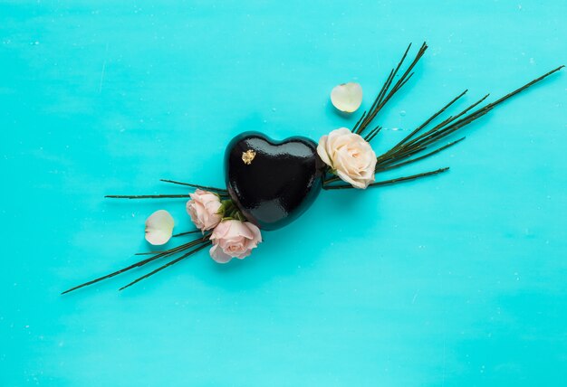 Flowers and cake in shape of heart