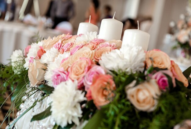 Photo flowers and candles on table during wedding