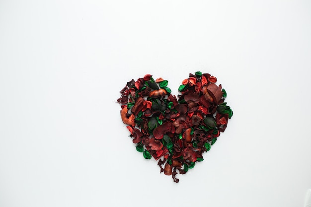 Flowers composition. Frame made of dried rose flowers on white background. Flat lay, top view, copy space