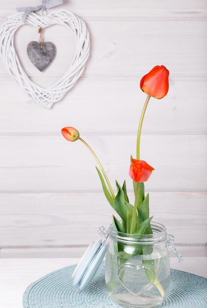 Flowers composition frame made of red flowers on white background valentines day flat lay top view