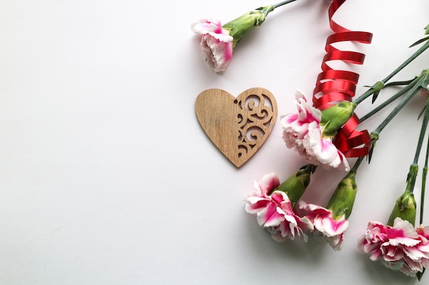 flowers and festive decor on a pink background