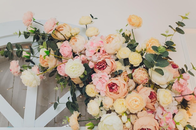 Flowers frame on white wooden background Top view with copy space