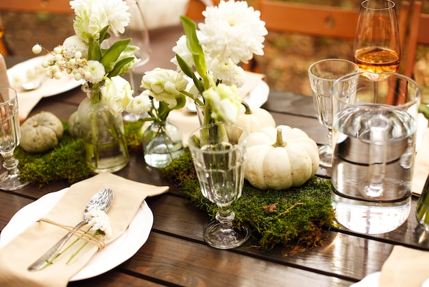 Photo flowers in glass vase on table