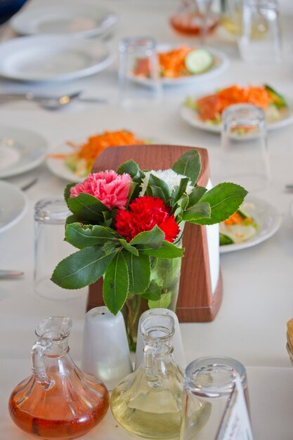 Flowers in glass vase on table