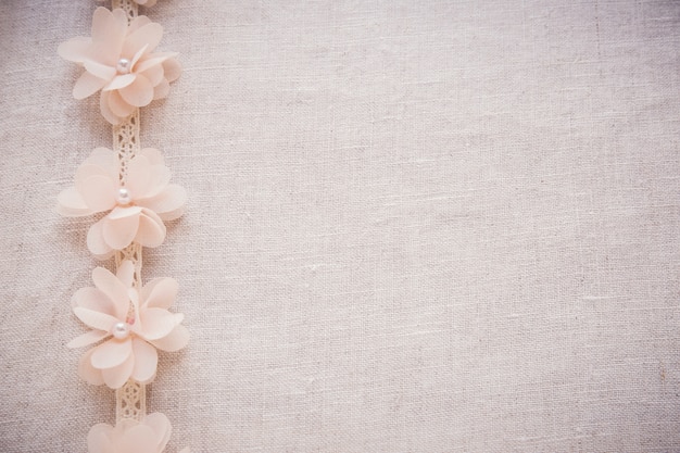 Flowers and lace on linen, copy space toning vintage wedding