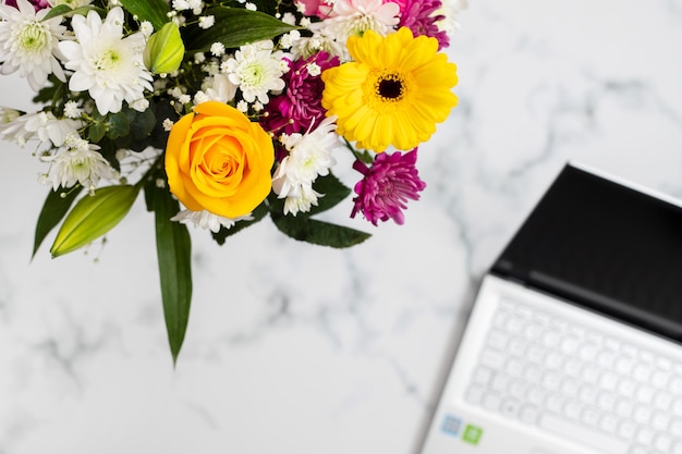 Photo flowers and notebook on light