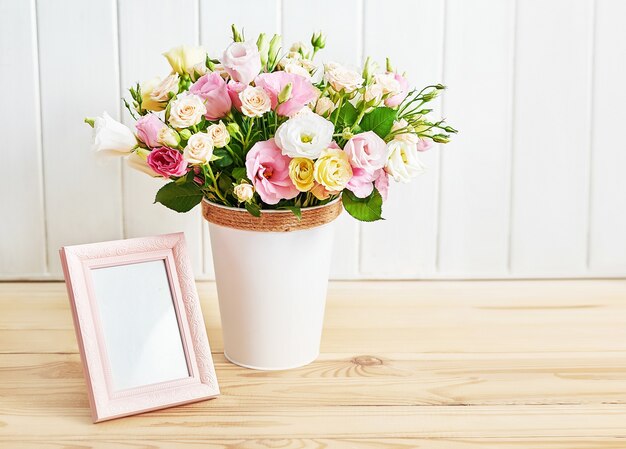 Flowers and photo frame, women's day.