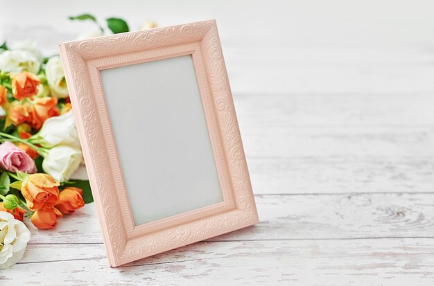 Flowers and photo frame, women's day.